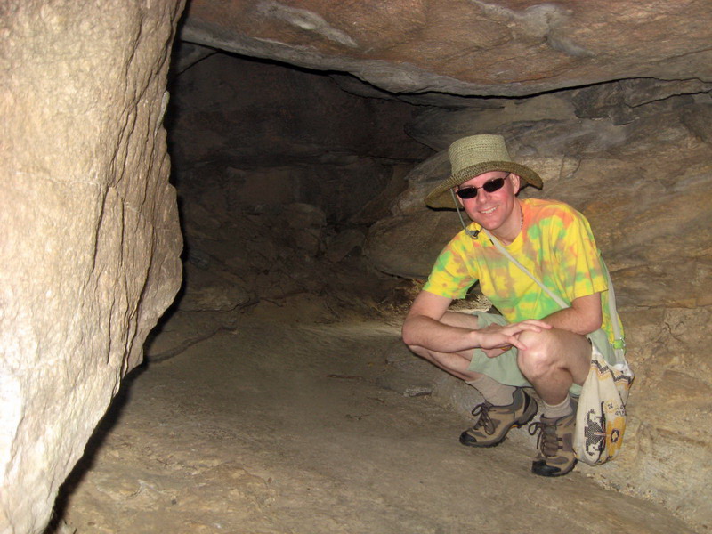 Richard smiling while exploring a cave